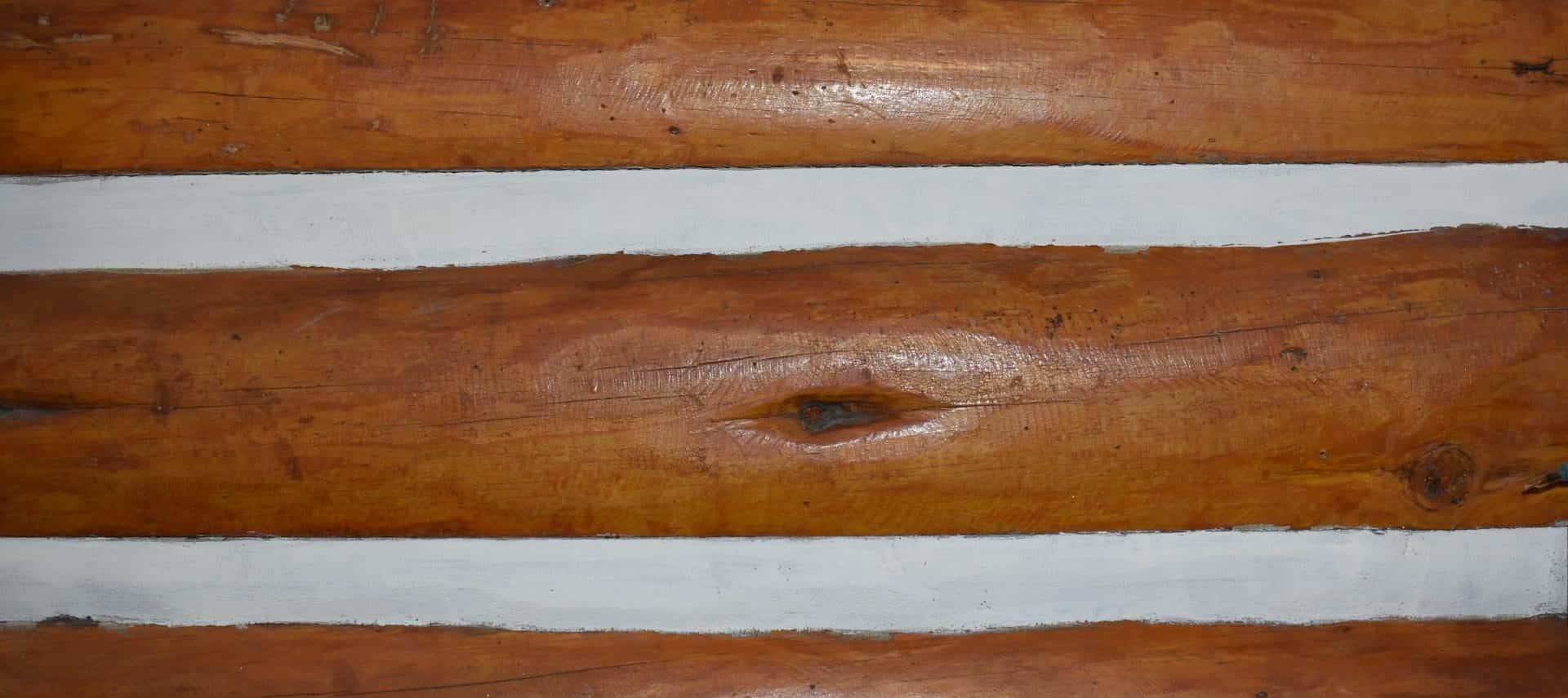 Close up view of a cabin's log walls