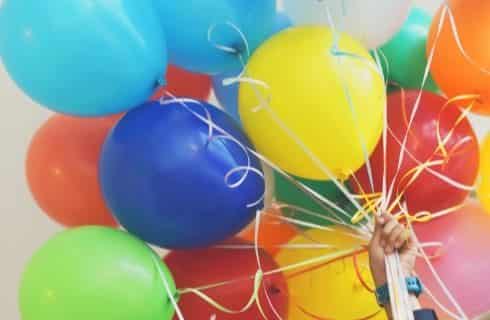 Multicolored balloons on strings in a bouquet